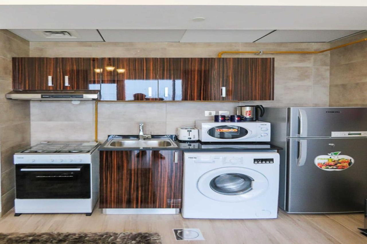 Oyo 860 Studio Apartment, Maya Tower 4, Jumeirah Village Triangle Дубай Екстер'єр фото